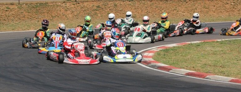 2015 SA Rotax Max Challenge DD2 champion Bradley Liebenberg (12) leads Nathan Parkins (13) and Arnold Neveling (44) at Zwartkops in the final round of the championship